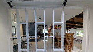 A modern interior with a dining area, kitchen, and living space.