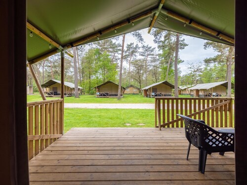 Glamping tent on campsite with swimming pool