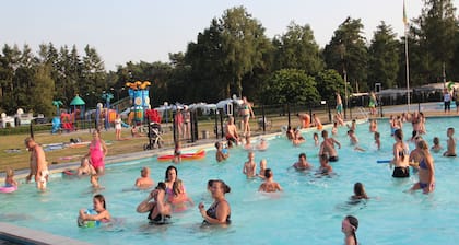 Glamping tent on campsite with swimming pool