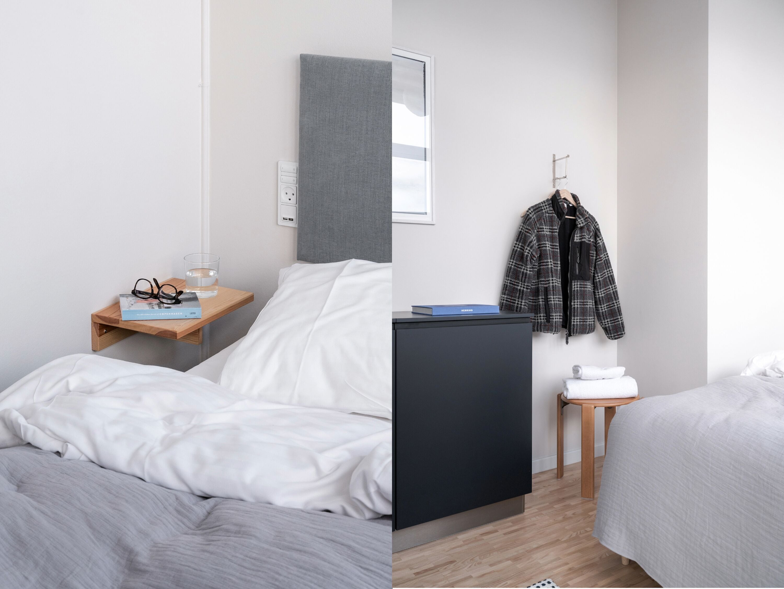 A modern hotel room with a bed, bedside table, and a wardrobe.