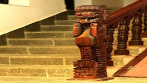 A wooden staircase with a carved balustrade. - MeroStay 218 HK HE (Nagarjun)