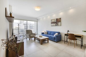 Basic Apartment, Multiple Beds | Living area | TV