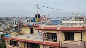 A building with a red roof and multiple windows. - MeroStay 219 Yam Homestay (Kathmandu)