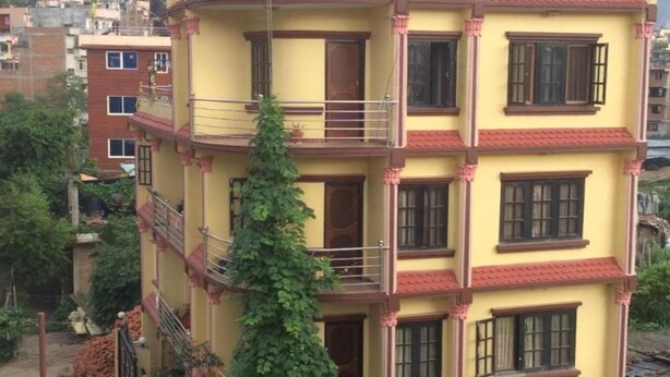 A multi-story building with balconies and windows. - MeroStay 219 Yam Homestay (Kathmandu)
