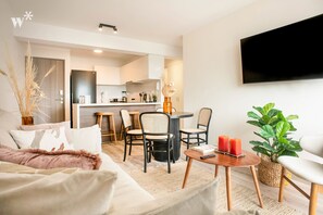 Elite Apartment | Living area | Flat-screen TV