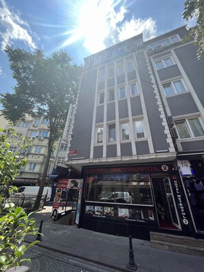 Hotel Metropol 2 features a modern facade with a prominent entrance and large windows.