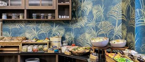 A buffet setup with various food items and condiments.