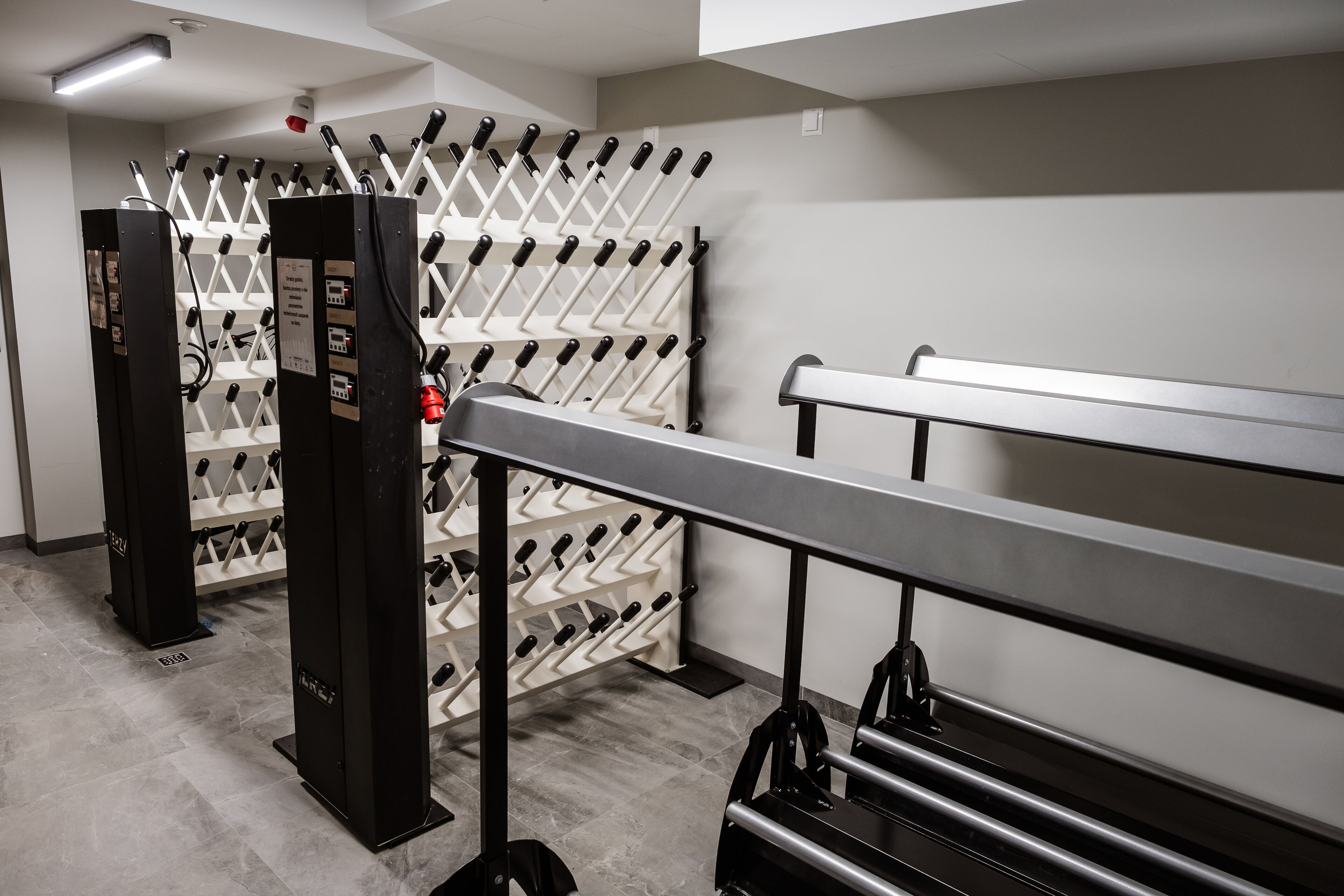 A wine storage area with racks and a bench.