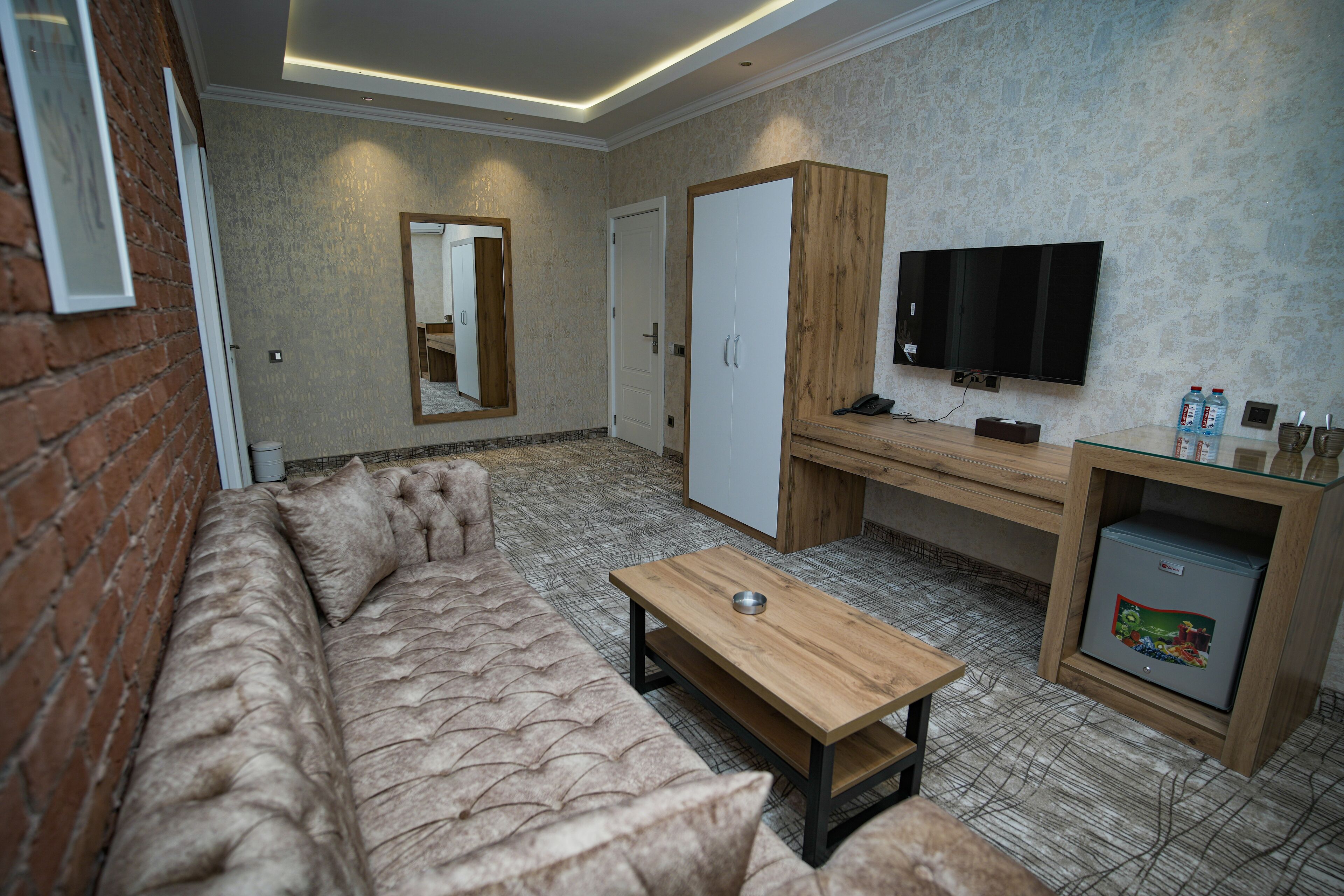 Superior Suite | Living area | 109-inch LCD TV with digital channels, TV, heated floors