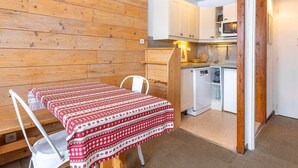 A compact kitchen with white cabinets, a microwave, and a sink. - Cozy apartment for 4 in Avoriaz with southeast-facing balcony (Avoriaz)