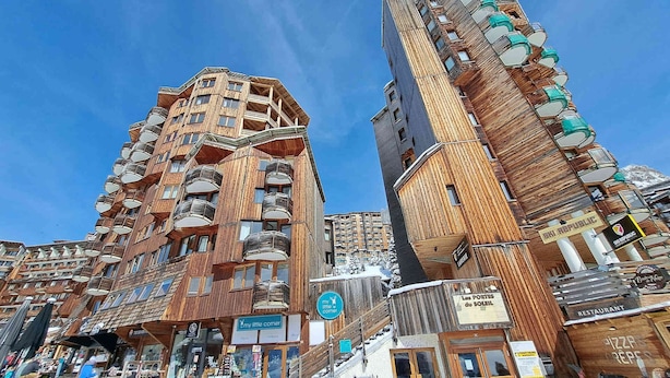A hotel with a wooden facade, multiple balconies, and a sign for 'my little corner' restaurant. - Studio for 2 with balcony in the center of Avoriaz (Avoriaz)