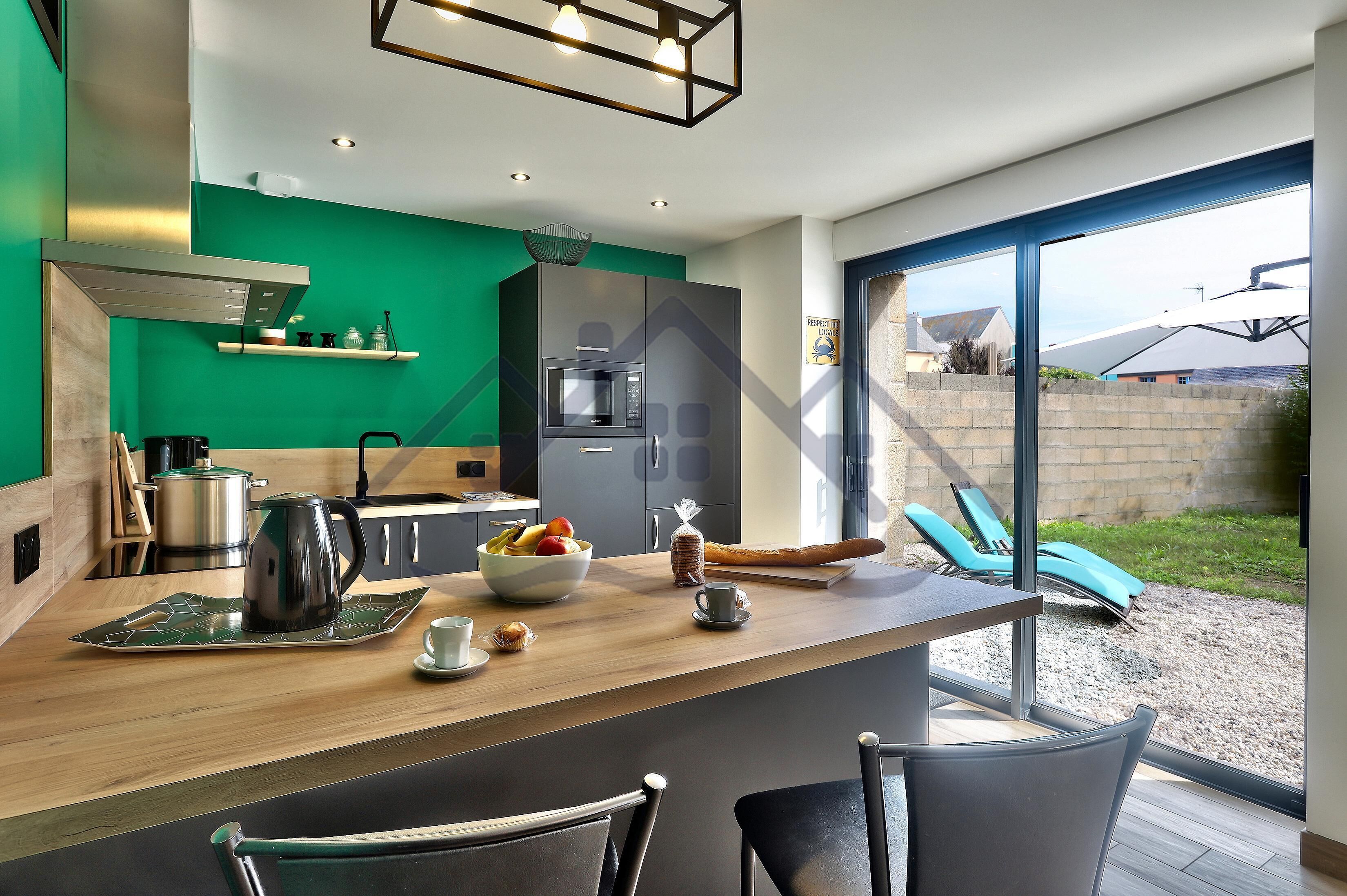 Fridge, microwave, coffee/tea maker, cookware/dishes/utensils