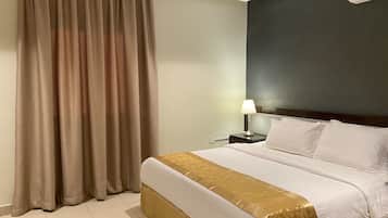 Suite Deluxe | Coffres-forts dans les chambres, fer et planche à repasser