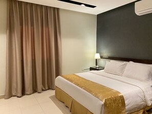 Deluxe Suite | In-room safe, iron/ironing board, free WiFi, bed sheets - Triple Tree Serviced Apartments  الشجرة الثلاثية للشقق المخدومة (Al-Hofuf)