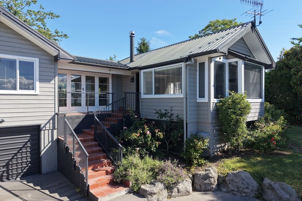 Exterior with plenty of parking in front of the house.