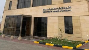 A building with a sign reading "Al Dunya" and "Triple Tree of Serviced Apartments". - Al Diyafa Serviced Apartments  الضيافة للشقق المخدومة (Al-Hofuf)