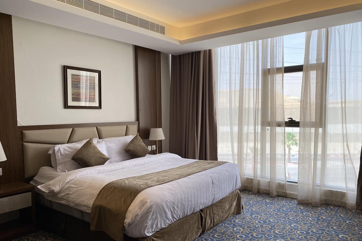 Suite, 1 King Bed | 2 bedrooms, in-room safe, individually furnished, iron/ironing board