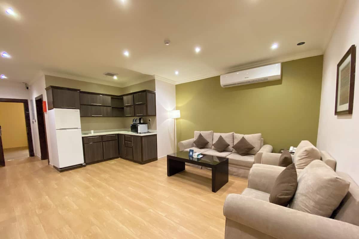 Deluxe Suite, 3 Bedrooms | Living area | 20-inch LCD TV with satellite channels, TV