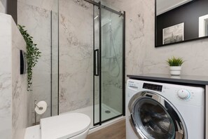 Shower, hair dryer, towels, shampoo