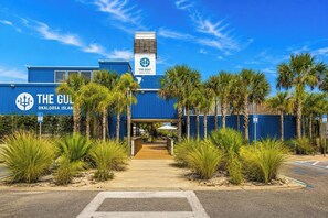 A building with a sign reading 'The Gulf Oklahoma Island.' - Okaloosa Island Gulf Front Paradise Studio Condo (Fort Walton Beach)