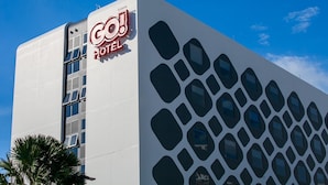 A modern hotel building with a distinctive geometric facade and a prominent 'Co!' sign. - GO Hotel Chonburi at Central Chonburi (Chonburi)