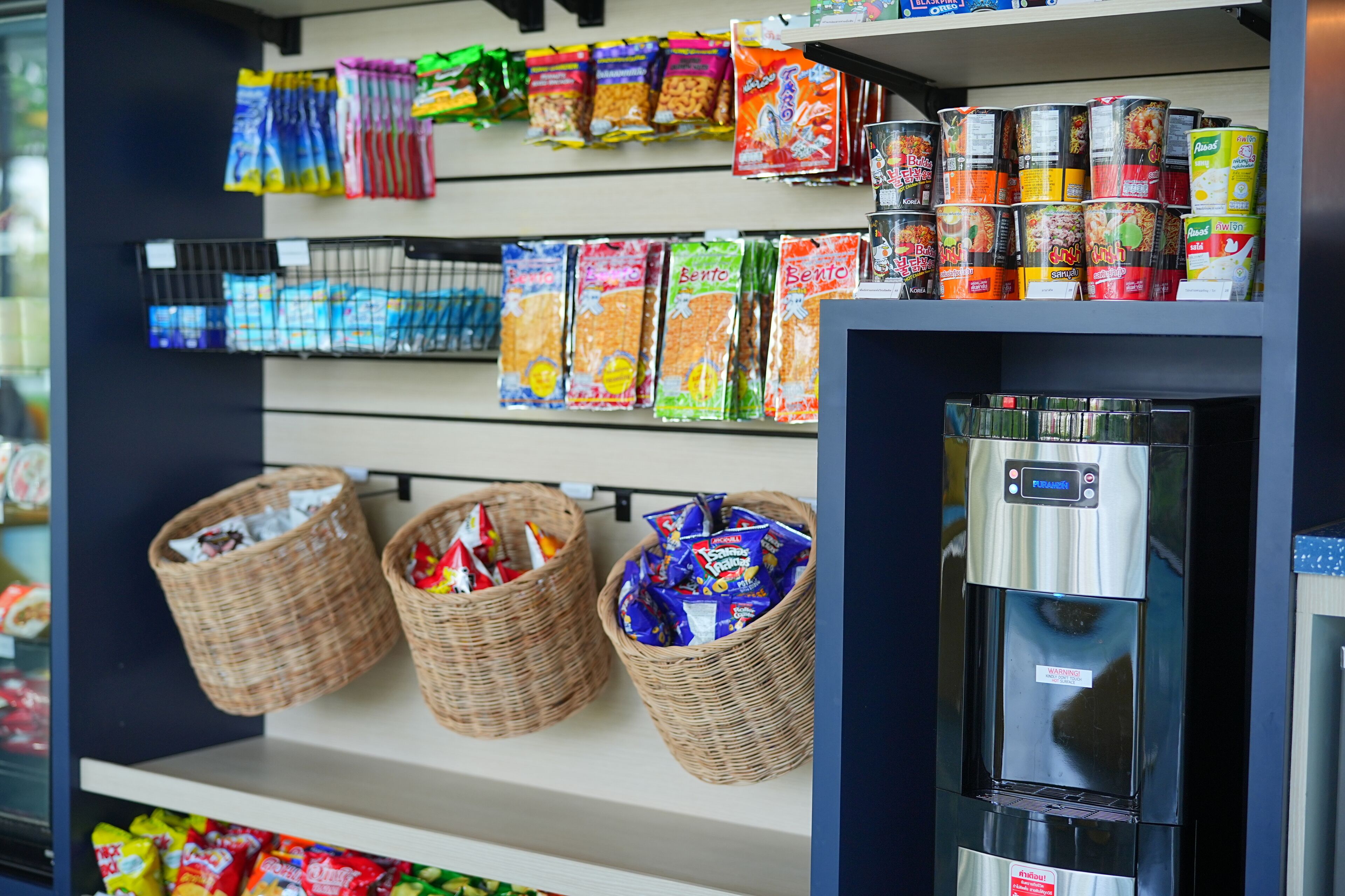 A grocery shelf stocked with various snacks and beverages.