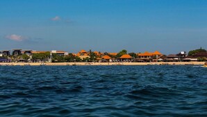 A coastal hotel with multiple buildings, a beach, and a view of the sea. - Private Room in Nusa Dua 300 Meters From Beach (Nusa Dua)
