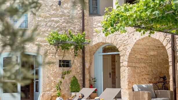 A stone building with a pool, outdoor furniture, and greenery. - Ivka in Tribalj With 4 Bedrooms and 4 Bathrooms (Vinodol)