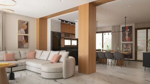 Ein modernes Wohnzimmer mit einem Ecksofa, einem Essbereich mit Holztisch und -stühlen sowie einer Küche im Hintergrund.