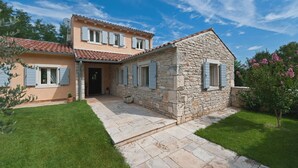A two-story house with a stone facade and a tiled roof. - Lipa in Krnica With 4 Bedrooms and 3 Bathrooms (Marcana)