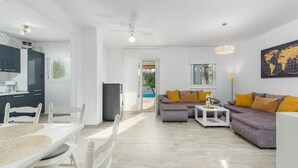 A modern living room with a dining area, a sofa set, and a kitchen. - Pendolina in Buje With 3 Bedrooms and 1 Bathrooms (Buje)