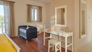 A bedroom with a bed, a desk, a chair, a dresser, a mirror, and a window with curtains. - Nella Hvar in Rudina Hvar (Stari Grad)