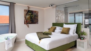 A modern bedroom with a green bed, white bedding, and a large window. - Four Seasons Vrsi in Vrsi (Vrsi)