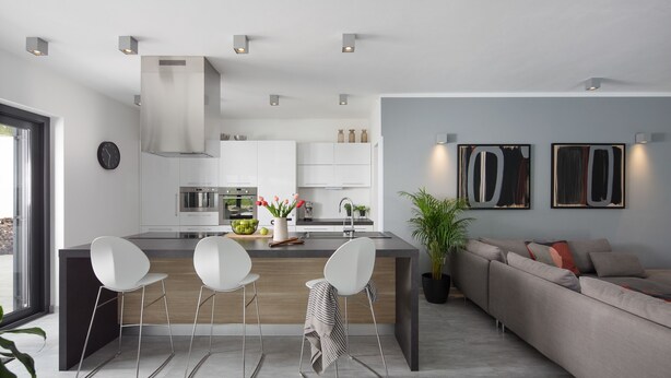 A modern kitchen with a central island, bar stools, and a dining area. - Arsia in Labin With 4 Bedrooms and 4 Bathrooms (Rasa)