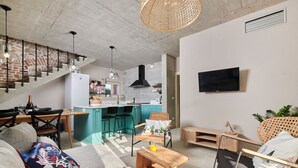 A modern living space with a kitchen, dining area, and seating area. - Mediterranea in Umag (Umag)