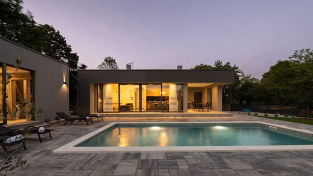 A modern house with a swimming pool, outdoor seating, and a well-maintained lawn. - Alison Deluxe in Zupanici (Sveta Nedelja)