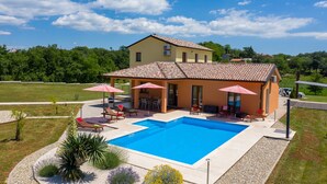 A two-story house with a swimming pool, outdoor seating, and a garden. - Frankovici in Pazin With 3 Bedrooms and 2 Bathrooms (Pazin)