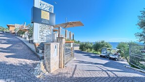 A paved pathway leading to a building with a sign reading "GOLDEN HAVEN". - Lux IV in Murter With 2 Bedrooms and 1 Bathrooms (Tisno)