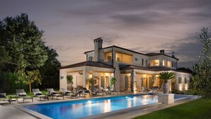 A large, two-story stone house with a swimming pool, outdoor seating, and a well-maintained garden. - Nevia in Ladi i With 5 Bedrooms and 5 Bathrooms (Kanfanar)