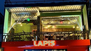 A two-story building with a sign reading "LAPIS Restaurant And Hostel". - Lapis Restaurant and Hostel (Nam Hoa Lu)