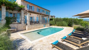 A stone building with a swimming pool and lounge chairs. - Sienna in Buzet With 4 Bedrooms and 2 Bathrooms (Buzet)