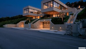 A modern two-story house with a flat roof, large windows, and a stone facade. - Soul Stella in Kor ula (Korčula)