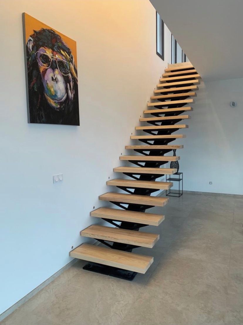 A modern staircase with a unique design, leading to a higher floor.