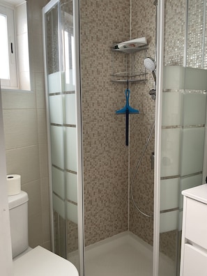 Shower, hair dryer, towels, soap
