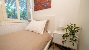2 habitaciones, tabla de planchar con plancha, wifi y ropa de cama