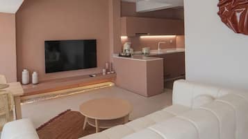 Luxury Room | Living area | 75-inch LED TV with satellite channels, TV, Netflix