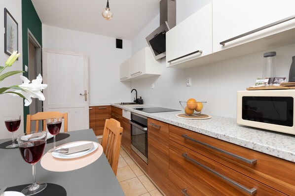 Apartment, 2 Bedrooms, Balcony | Private kitchen | Microwave, oven, dishwasher, cookware/dishes/utensils