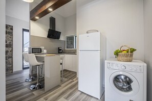 Fridge, microwave, stovetop, coffee/tea maker