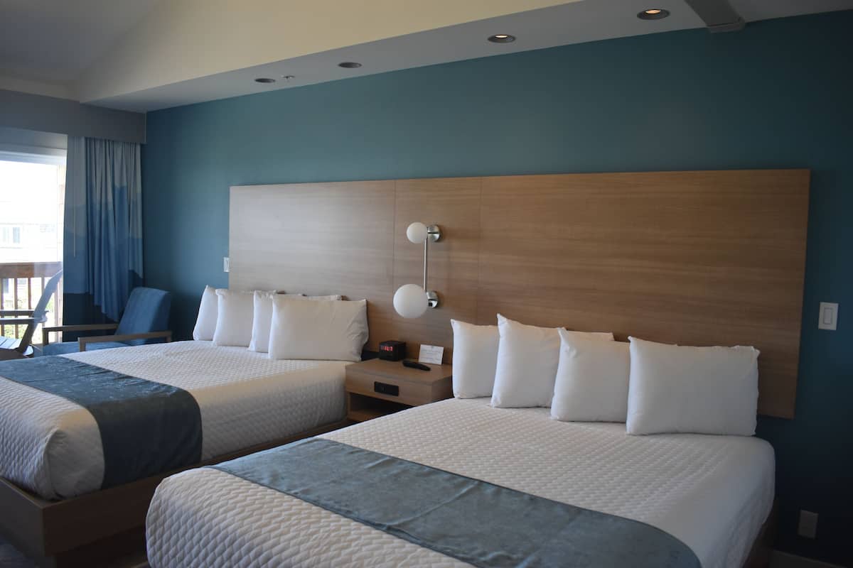 Deluxe Double Room, 2 Queen Beds, Balcony, Ocean View | Blackout curtains, iron/ironing board, free WiFi, bed sheets