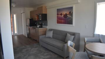 Family Double Room, Multiple Beds, Fireplace, Ocean View | Living area | 50-inch Smart TV with cable channels, TV